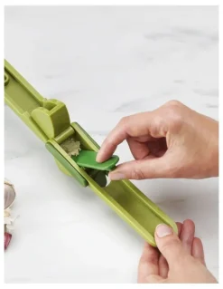 Joseph Joseph Clean Force Garlic Press in Green