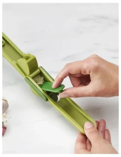 Joseph Joseph Clean Force Garlic Press in Green